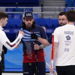 
              Britain's Bruce Mouat, left, and Grant hardie greet United States' Christopher Plys, second left, and John Landsteiner at the end of the men's curling semifinal match between Britain and the United States at the Beijing Winter Olympics Thursday, Feb. 17, 2022, in Beijing. (AP Photo/Brynn Anderson)
            
