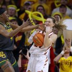
              Baylor center Queen Egbo (4) and Iowa State guard Ashley Joens (24) vie for a rebound during the first half of an NCAA college basketball game Monday, Feb. 28, 2022, in Ames, Iowa. (AP Photo/Matthew Putney)
            