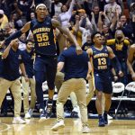 
              Murray State forward D.J. Burns (55) celebrates with teammates after they defeated Tennessee-Martin in an NCAA college basketball game Saturday, Feb. 19, 2022, in Martin, Tenn. (AP Photo/Mark Zaleski)
            