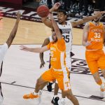 
              Tennessee guard Santiago Vescovi (25) blocks a shot by Mississippi State forward D.J. Jeffries (13) during the second half of an NCAA college basketball game in Starkville, Miss., Wednesday, Feb. 9, 2022. (AP Photo/Rogelio V. Solis)
            