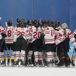 
              Canada players celebrate after a win against the United States during a preliminary round women's hockey game at the 2022 Winter Olympics, Tuesday, Feb. 8, 2022, in Beijing. (AP Photo/Petr David Josek)
            