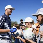 
              Detroit Lions NFL quarterback Jared Goff smiles as he signs autographs during the Pro-Am at the Phoenix Open golf tournament Wednesday, Feb. 9, 2022, in Scottsdale, Ariz. (AP Photo/Ross D. Franklin)
            