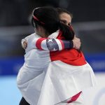 
              Gold medal winner Miho Takagi of Japan hugs bronze medalist Brittany Bowe of the United States, facing right, after the women's speedskating 1,000-meter finals at the 2022 Winter Olympics, Thursday, Feb. 17, 2022, in Beijing. (AP Photo/Ashley Landis)
            