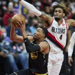 
              Golden State Warriors forward Otto Porter Jr., left, shoots in front of Portland Trail Blazers forward Greg Brown III during the first half of an NBA basketball game in Portland, Ore., Thursday, Feb. 24, 2022. (AP Photo/Craig Mitchelldyer)
            