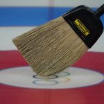 
              A broom is used for target guidance at the curling venue ahead of the Beijing Winter Olympics Tuesday, Feb. 1, 2022, in Beijing. (AP Photo/Brynn Anderson)
            