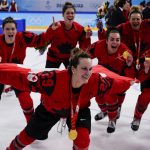 
              Canada's Marie-Philip Poulin (29) celebrates with her gold medal after the women's gold medal hockey game at the 2022 Winter Olympics, Thursday, Feb. 17, 2022, in Beijing. (AP Photo/Matt Slocum)
            