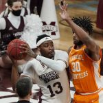
              Mississippi State forward D.J. Jeffries (13) looks for an opening to pass against Tennessee guard Josiah-Jordan James (30) during the first half of an NCAA college basketball game in Starkville, Miss., Wednesday, Feb. 9, 2022. (AP Photo/Rogelio V. Solis)
            