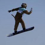 
              Lucile Lefevre of France competes during the women's snowboard big air qualifications of the 2022 Winter Olympics, Monday, Feb. 14, 2022, in Beijing. (AP Photo/Jae C. Hong)
            