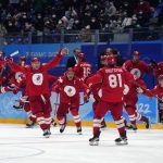 
              The Russian Olympic Committee celebrates the winning goal during a shootout by Arseni Gritsyuk (81) in a men's semifinal hockey game against Sweden at the 2022 Winter Olympics, Friday, Feb. 18, 2022, in Beijing. (AP Photo/Petr David Josek)
            