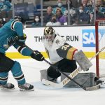 
              Vegas Golden Knights goaltender Logan Thompson, right, defends against a shot attempt by San Jose Sharks center Logan Couture during the first period of an NHL hockey game in San Jose, Calif., Sunday, Feb. 20, 2022. (AP Photo/Jeff Chiu)
            