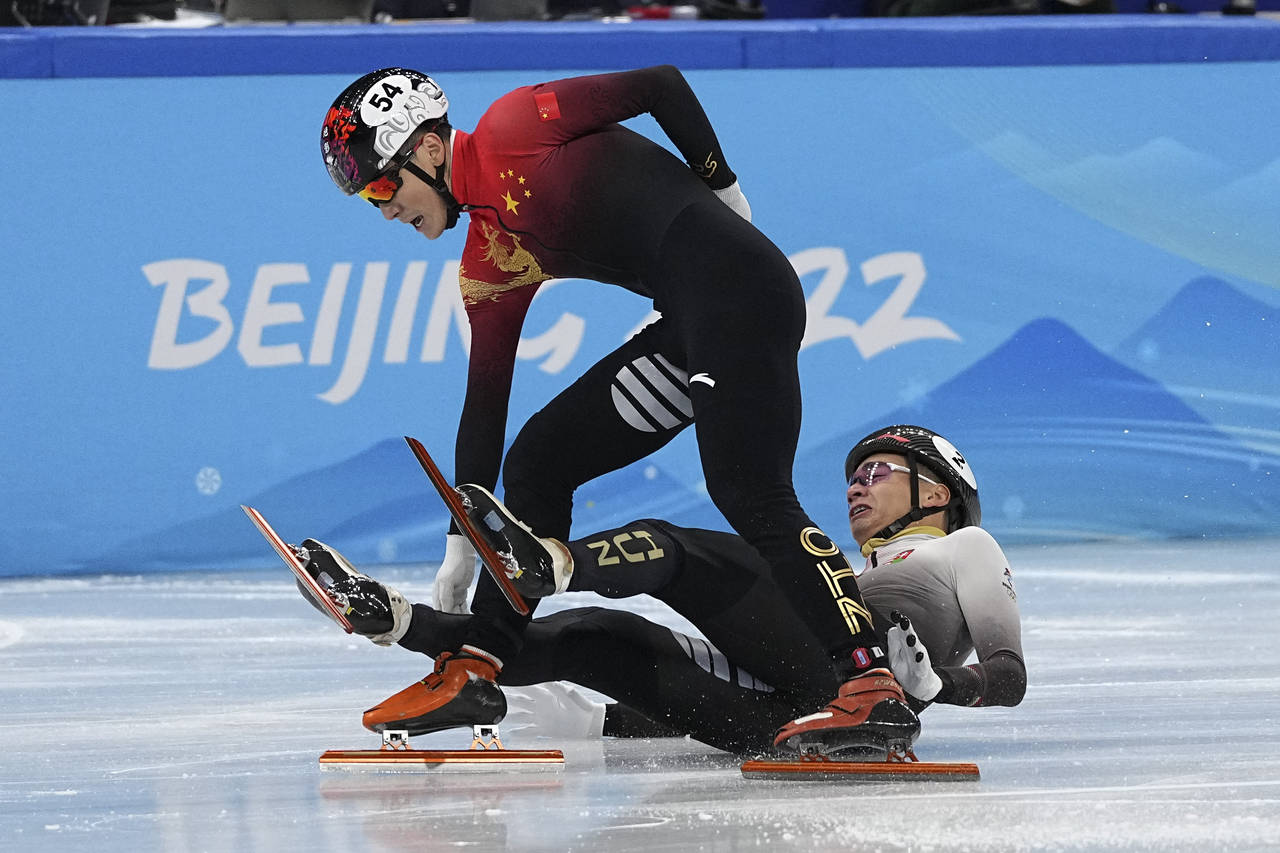 Ren Ziwei of China, and Shaolin Sandor Liu of Hungary, clash as they cross the finish line in the m...