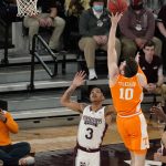 
              Tennessee forward John Fulkerson (10) uses some body English to attempt this shot past the defense of Mississippi State guard Shakeel Moore (3) during the first half of an NCAA college basketball game in Starkville, Miss., Wednesday, Feb. 9, 2022. (AP Photo/Rogelio V. Solis)
            