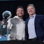 
              CORRECTS SPELLING TO LOMBARDI, NOT LOMBARDY AS ORIGINALLY SENT - Los Angeles Rams head coach Sean McVay, left, holds the Vince Lombardi trophy during a press conference while posing for photos with league commissioner Roger Goodell following the NFL football team's Super Bowl win over the Cincinnati Bengals Monday, Feb. 14, 2022, in Los Angeles. (AP Photo/Marcio Jose Sanchez)
            