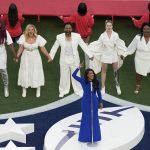
              Country music artist Mickey Guyton performs the national anthem before the NFL Super Bowl 56 football game between the Los Angeles Rams and the Cincinnati Bengals, Sunday, Feb. 13, 2022, in Inglewood, Calif. (AP Photo/Matt Rourke)
            