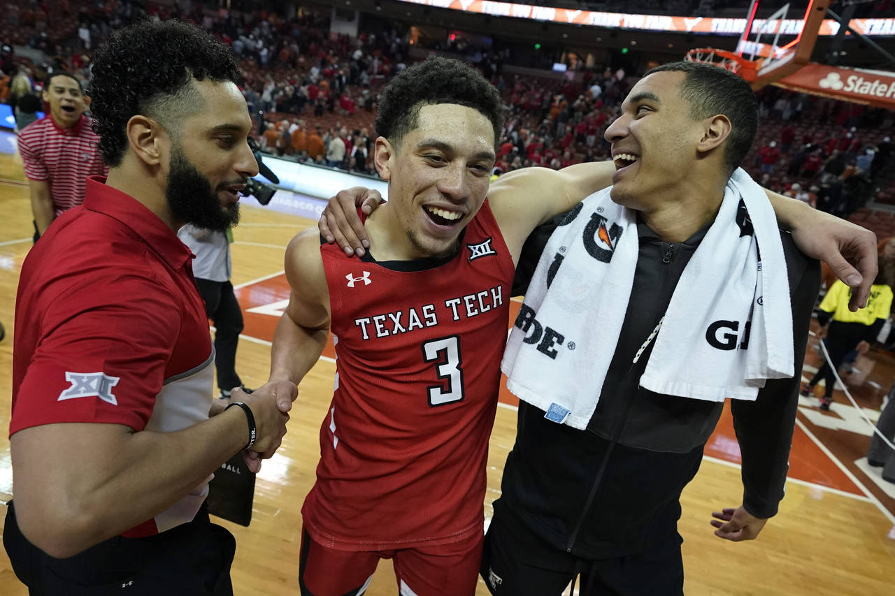 Texas Tech guard Clarence Nadolny (3) celebrates the team's win over Texas in an NCAA college baske...
