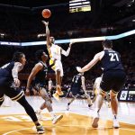 
              Tennessee guard Zakai Zeigler (5) shoots over Vanderbilt guard Rodney Chatman (3) during the first half of an NCAA college basketball game Saturday, Feb. 12, 2022, in Knoxville, Tenn. (AP Photo/Wade Payne)
            