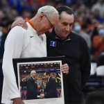 
              Syracuse coach Jim Boeheim, left, presents Duke coach Mike Krzyzewski with a gift before an NCAA college basketball game in Syracuse, N.Y., Saturday, Feb. 26, 2022. (AP Photo/Adrian Kraus)
            