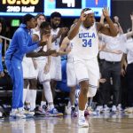 
              UCLA guard David Singleton (34) reacts after making a 3-point basket during the second half of an NCAA college basketball game against Arizona State, Monday, Feb. 21, 2022, in Los Angeles. (AP Photo/Marcio Jose Sanchez)
            