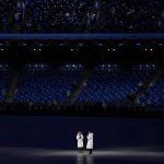 
              Hosts address the crowd during the pre-show ahead of the opening ceremony of the 2022 Winter Olympics, Friday, Feb. 4, 2022, in Beijing. (AP Photo/Jae C. Hong)
            