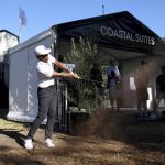
              Tony Finau hits his third shot past spectators on the eighth hole during the first round of the Genesis Invitational golf tournament at Riviera Country Club, Thursday, Feb. 17, 2022, in the Pacific Palisades area of Los Angeles. (AP Photo/Ryan Kang)
            