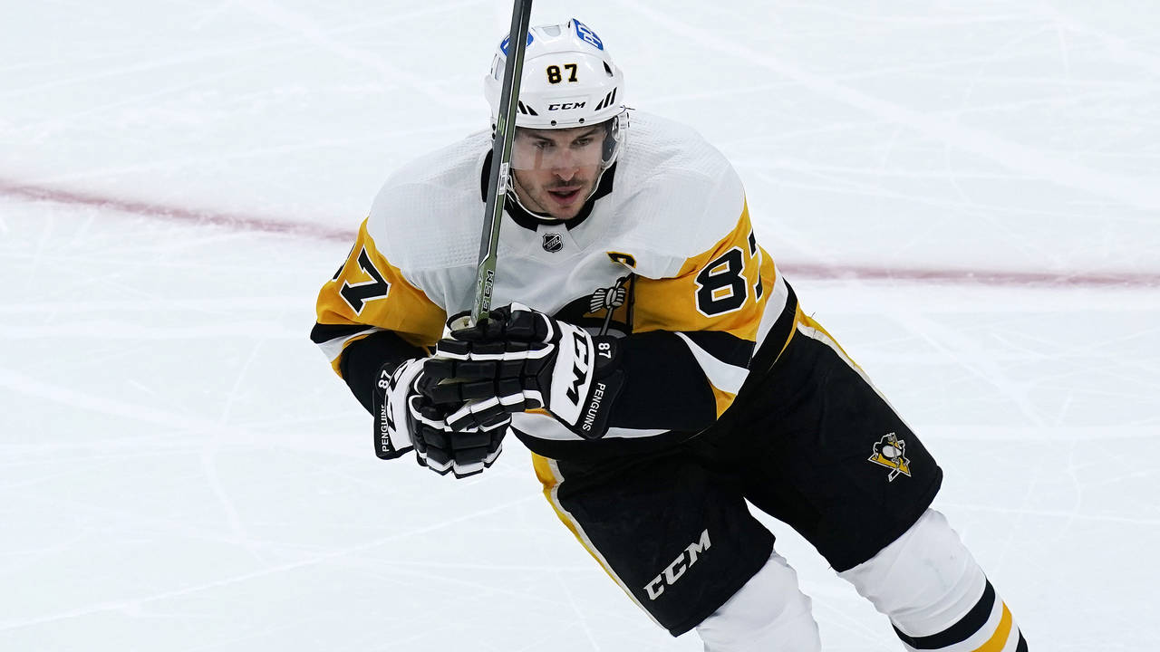Pittsburgh Penguins center Sidney Crosby skates down ice against the Boston Bruins during the first...