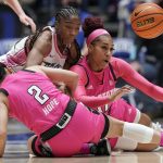
              North Carolina State guard Raina Perez (2) and forward Jakia Brown-Turner (11) struggle for the ball with Duke guard Shayeann Day-Wilson during the second half of an NCAA college basketball game in Durham, N.C., Sunday, Feb. 13, 2022. (AP Photo/Gerry Broome)
            