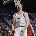 
              Gonzaga forward Drew Timme celebrates after scoring a basket during the second half of the team's NCAA college basketball game against Saint Mary's, Saturday, Feb. 12, 2022, in Spokane, Wash. Gonzaga won 74-58. (AP Photo/Young Kwak)
            