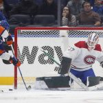 
              Andrew Hammond (37) of the Montreal Canadiens defends a scoring chance early during the second period from Anders Lee (27) of the New York Islanders at UBS Arena on Sunday, Feb. 20, 2022 in Elmont, N.Y. (Jim McIsaac/Newsday via AP)
            