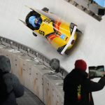 
              Francesco Friedrich of Germany and his team drive their 4-man bobsled during a training heat at the 2022 Winter Olympics, Thursday, Feb. 17, 2022, in the Yanqing district of Beijing. (AP Photo/Dmitri Lovetsky)
            