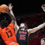
              Utah guard Rollie Worster (25) defends against Oregon State guard Dashawn Davis (13) in the first half during an NCAA college basketball game Thursday, Feb. 3, 2022, in Salt Lake City. (AP Photo/Rick Bowmer)
            