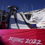 
              The logo of Beijing 2022 is written on a banner at the ski jumping stadium at the 2022 Winter Olympics, Tuesday, Feb. 1, 2022, in Zhangjiakou, China. (AP Photo/Matthias Schrader)
            