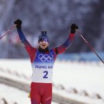 
              Johannes Thingnes Boe of Norway crosses the finish line in the men's 15-kilometer mass start biathlon at the 2022 Winter Olympics, Friday, Feb. 18, 2022, in Zhangjiakou, China. (AP Photo/Kirsty Wigglesworth)
            