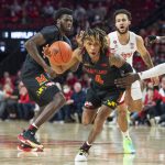 
              Maryland's Fatts Russell (4) drives with the ball during the first half of the team's NCAA college basketball game against Nebraska on Friday, Feb. 18, 2022, in Lincoln, Neb. (Jaiden Tripi/Lincoln Journal Star via AP)
            