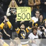 
              A fan holds up a sign recognizing the 500th goal after Pittsburgh Penguins' Sidney Crosby, (87) scored his 500th NHL career goal against the Philadelphia Flyers, during the first period of an NHL hockey game, Tuesday, Feb. 15, 2022, in Pittsburgh. (AP Photo/Keith Srakocic)
            
