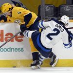 
              Winnipeg Jets defenseman Dylan DeMelo (2) collides with Nashville Predators left wing Filip Forsberg (9) as they battle for the puck during the first period of an NHL hockey game Saturday, Feb. 12, 2022, in Nashville, Tenn. (AP Photo/Mark Zaleski)
            