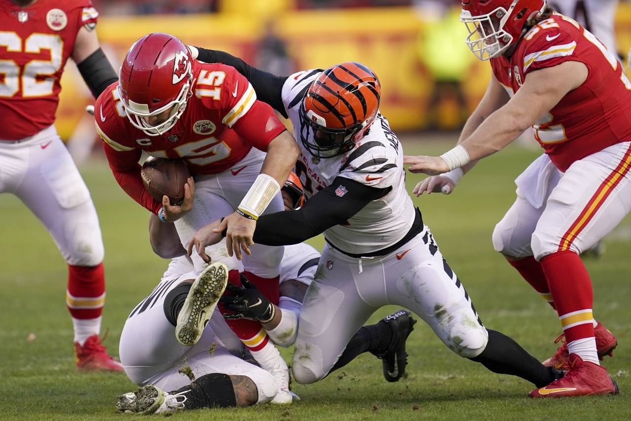 Kansas City Chiefs quarterback Patrick Mahomes (15) is sacked by Cincinnati Bengals defensive end T...