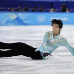 
              Yuzuru Hanyu, of Japan, falls in the men's free skate program during the figure skating event at the 2022 Winter Olympics, Thursday, Feb. 10, 2022, in Beijing. (AP Photo/Natacha Pisarenko)
            