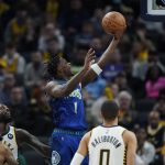 
              Minnesota Timberwolves' Anthony Edwards (1) shoots during the second half of an NBA basketball game against the Indiana Pacers, Sunday, Feb. 13, 2022, in Indianapolis. (AP Photo/Darron Cummings)
            