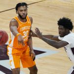 
              Tennessee guard Josiah-Jordan James (30) passes the ball as Mississippi State guard Cameron Matthews (4) watches during the second half of an NCAA college basketball game in Starkville, Miss., Wednesday, Feb. 9, 2022. (AP Photo/Rogelio V. Solis)
            