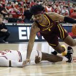 
              Minnesota's Eric Curry, right, collides with Ohio State's E.J. Liddell during the first half of an NCAA college basketball game Tuesday, Feb. 15, 2022, in Columbus, Ohio. (AP Photo/Jay LaPrete)
            