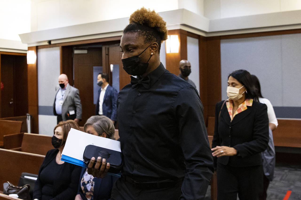 FILE - Former Las Vegas Raiders wide receiver Henry Ruggs III arrives at court during his hearing a...