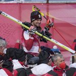 
              Johannes Strolz, of Austria, gold, celebrates with teammates after the medal ceremony for the the men's combined at the 2022 Winter Olympics, Thursday, Feb. 10, 2022, in the Yanqing district of Beijing. (AP Photo/Luca Bruno)
            