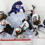 
              Germany goalkeeper Danny aus den Birken makes a save during a preliminary round men's hockey game between United States and Germany at the 2022 Winter Olympics, Sunday, Feb. 13, 2022, in Beijing. (AP Photo/Petr David Josek)
            