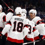 
              Ottawa Senators players celebrate after a goal by Ottawa Senators' Nick Holden (5) against the New York Islanders during the first period of an NHL hockey game Tuesday, Feb. 1, 2022, in Elmont, N.Y. (AP Photo/Jason DeCrow)
            