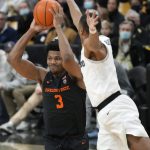 
              Oregon State guard Dexter Akanno, left, is defended by Colorado guard Keeshawn Barthelemy during the first half of an NCAA college basketball game Saturday, Feb. 5, 2022, in Boulder, Colo. (AP Photo/David Zalubowski)
            