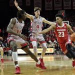 
              Wisconsin guard Chucky Hepburn (23) drives to the basket past Rutgers guard Paul Mulcahy (4) and center Clifford Omoruyi (11) during the first half of an NCAA college basketball game Saturday, Feb. 26, 2022, in Piscataway, N.J. (AP Photo/Adam Hunger)
            
