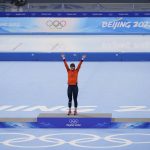 
              Irene Schouten of the Netherlands, center, jumps on to the podium during a venue ceremony after winning gold in the women's speedskating mass start final at the 2022 Winter Olympics, Saturday, Feb. 19, 2022, in Beijing. Ivanie Blondin of Canada, left, won silver, and Francesca Lollobrigida of Italy, right, won bronze. (AP Photo/Sue Ogrocki)
            