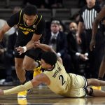 
              Vanderbilt guard Scotty Pippen Jr. (2) reaches for the ball after Missouri guard Javon Pickett (4) knocked it out of the hands of Pippen during the second half of an NCAA college basketball game Tuesday, Feb. 8, 2022, in Nashville, Tenn. Vanderbilt won 70-62. (AP Photo/Mark Zaleski)
            
