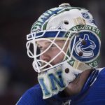 
              Vancouver Canucks goalie Thatcher Demko looks on during a stoppage in play during the third period of an NHL hockey game against the Toronto Maple Leafs in Vancouver, British Columbia, Saturday, Feb. 12, 2022. (Darryl Dyck/The Canadian Press via AP)
            