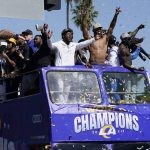 
              Confetti flies as Los Angeles Rams players celebrate on a bus during the team's victory parade in Los Angeles, Wednesday, Feb. 16, 2022, following their win Sunday over the Cincinnati Bengals in the NFL Super Bowl 56 football game. (AP Photo/Marcio Jose Sanchez)
            
